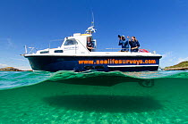 Photographer Chris Gomersall taking pictures from SeaLife Surveys ecotourism boat Sula Crion, whilst on assignment for 2020VISION, Cairns of Coll, Inner Hebrides, Scotland, UK, July 2011. Model Releas...