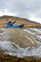Kayaker on the River Etive, Highlands, Scotland, UK, April 2012.
