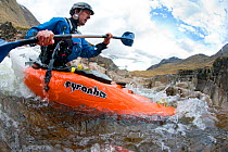 Kayaker on the River Etive, Highlands, Scotland, UK, April 2012. Did you know? Freshwater ecosystems have a higher density of species than either the land or the sea.