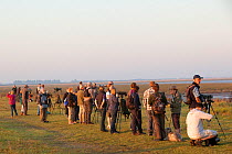 Birdwatchers at RSPB Snettisham Reserve. The Wash Estuary, Norfolk, October 2011.
