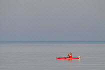Kayaker at dawn. The Wash Estuary, Norfolk, September.