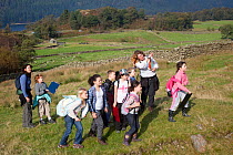 School children learning about upland ecology as part of Flora of the Fells day. Helvellyn, Lake District National Park, Cumbria, September.