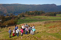 School children learning about upland ecology as part of Flora of the Fells day. Helvellyn, Lake District National Park, Cumbria, September.