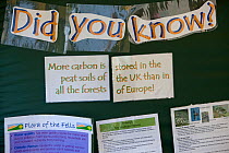 'Did you know More carbon is stored in the peat soils of the UK than in all the forests of Europe' sign at  Flora of the Fells conservation day, Helvellyn, Lake District NP, Cumbria