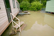 Flooded caravan site in Dol y bont by River Leri after 5 inches of rain in 2 days 10th June 2012, Ceredigion, Wales, UK