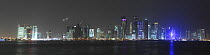 Night skyline of  buildings in Doha, Qatar, Arabian Gulf. May 2011, panorama format, digital composite