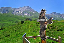 Viewpoint with sign depicting a Red kite (Milvus milvus) for watching birds of prey at the Col du Soulor, Hautes-Pyrenees, Pyrenees, France, June 2012