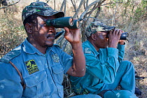 Anti-poaching unit on patrol in the bush, l-rSibusiso Mdluli, Sibongiseni Kunene, Ezemvelo KZN Wildlife, iMfolozi game reserve, KwaZulu-Natal, South Africa, June 2012. Editorial use only