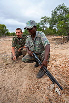 Anti-poaching unit on patrol in the bush, l-r Abre Marais, Eric Moletshe, Protrack anti-poaching unit, Hoedspruit, South Africa, June 2012. Editorial use only