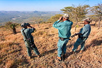 Anti-poaching unit on patrol in the bush, l-r Mshiyeni Ntuli, Sibongiseni Kunene, Sibusiso Mdluli, Ezemvelo KZN Wildlife, iMfolozi game reserve, KwaZulu-Natal, South Africa, June 2012. Editorial use o...