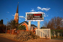 South African church with save the rhino anti-poaching slogan on electronic advertising billboard, Klerksdorp, North west province, South Africa, June 2012. Editorial use only