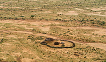 Maasai dwelling enclosure seen from the air. Lochechar, Kenya, Africa, September 2011.