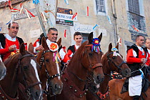 Traditionally dressed riders parading during the Madonna dei Martiri festival, in Fonni, Nuoro district, Sardinia, Italy.