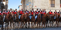 Traditionally dressed riders parading during the Madonna dei Martiri festival, in Fonni, Nuoro district, Sardinia, Italy.