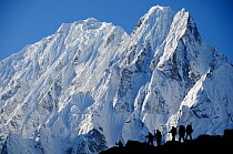 Trekkers infront of Kampungge Himal, Annapurna Conservation Area, Himalayas, Nepal, October 2009. No release available.