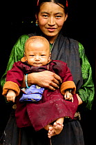 Mother with her son, Manaslu Conservation Area, Himalayas, Nepal, October 2009.