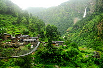 Bridge across to village in Budhi Gandaki river valley. Manaslu Conservation Area, Himalayas, Nepal, October 2009.