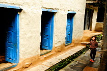 Blue coloured doors in a small village in the valley of the Budhi Gandaki river. Manaslu Conservation Area, Himalayas, Nepal, October 2009.