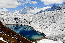 Looking down on glacial lake in the mountains, Manaslu Conservation Area, Himalayas, Nepal, October 2009.