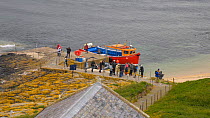 Timelapse of tourists arriving on the Farne Islands by boat, Northumberland, England, UK, July 2011