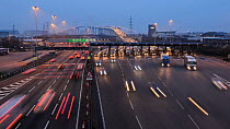 Timelapse of traffic using the Dartford Crossing at dusk, with the Queen Elizabeth II Bridge in the background, Kent, England, UK, March 2012
