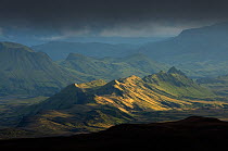 Hagafjell in sunlight with stormy clouds, Thorsmork, Fjallabak Nature Reserve, Iceland. August 2010