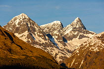 Early morning light on the Earl Mountains, from the left, Mt Ngatmamoe (2174m), Mt Flattop (2282m) and Mt Pyramid (2295m), taken from Key Summit (918m); Fiordland National Park, Southland, South Islan...