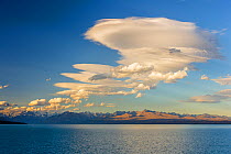 Lenticular clouds over Lake Pukaki and the Southern Alps. Aoraki/Mount Cook National Park, Mackenzie District, Canterbury, South Island, New Zealand. January, 2009.