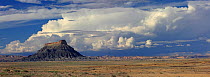 Panoramic view of rocky outcrop and cumulo-nimbus clouds across the state of Utah, USA