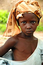 Portrait of a young girl. Bassari country, east  Senegal. This area became a UNESCO World Heritage site in 2012, for cultural landscape and traditions kept by the the Bassari, Fula and Bedik peoples....