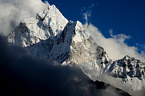 Ama Dablam (6.856 m) surrounded by clouds, Sagarmatha National Park (World Heritage UNESCO). Khumbu / Everest Region, Nepal, Himalaya, October 2011.