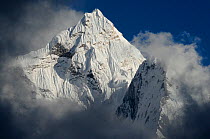 Ama Dablam (6.856 m) surrounded by clouds, Sagarmatha National Park (World Heritage UNESCO). Khumbu / Everest Region, Nepal, Himalaya, October 2011.