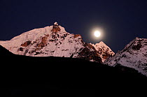 Moon over the mountains in Sagarmatha National Park (World Heritage UNESCO). Khumbu / Everest Region, Nepal, Himalaya, October 2011.