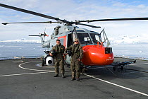 Aerial cameraman David Baillie and producer Martha Holmes on flight deck of HMS Endurance, standing by helicopter mounted with Gyron (stabilised aerial camera). February 20008. Taken on location for B...