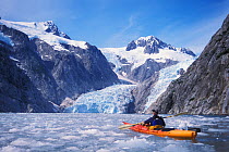 Kayaker in front of Bear Glacier, Kenai Fjords National Park, Alaska, USA. No release available.