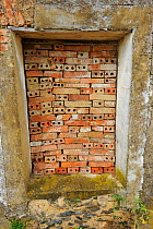 Bricked up window in abandonned building - Land abandonment in Martiago village, Salamanca Region, Castilla y Leon, Spain, May 2011
