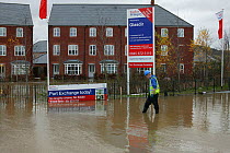 Flooding of newly built housing in the Glasdir estate with houses for sale, Ruthin, the Vale of Clwyd, Denbighshire, Wales, UK.  This is an area at risk of flooding and therefore difficult to obtain H...