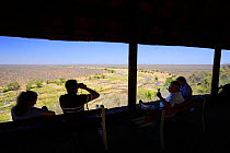Tourists looking from the Olifants Camo lookout hide, Kruger National Park, Transvaal, South Africa, September 2008.