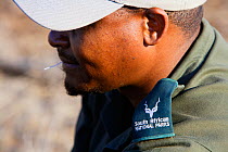 Portrait of a South African Parks Ranger whilst supervising a walking safari, Kruger National Park, Transvaal, South Africa, September 2008. No release available.