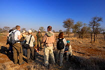 Tourists on a walking safari near Olifants river, Kruger National Park, Transvaal, South Africa, September 2008.