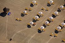 Sun loungers on Jumeria Beach in Dubai, near to Burj Al Arab, aerial view. UAE, January 2010