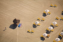 Sun Loungers on Jumeria Beach in Dubai, near to Burj Al Arab, aerial view. UAE, January 2010