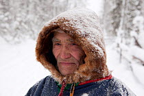 Ivan Agichev, an elderly Selkup man, out in the forest in the winter. Krasnoselkup, Yamal, Western Siberia, Russia 2012