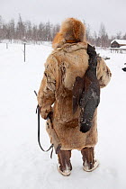 Kosta, a Selkup man, returns to a winter camp after hunting Capercaille, Krasnoselkup, Yamal, Western Siberia, Russia 2012
