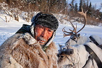 Gennadiy Kubolev, a Selkup hunter, with his draft reindeer on the frozen Shirta River, Krasnoselkup, Yamal, Western Siberia, Russia 2012
