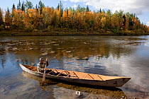 On an autumn day, Gennadiy Kubolev, a Selkup man, about to go fishing in his 'Anty' (traditional dugout boat) on the River Shirta, Krasnoselkup, Yamal, Western Siberia, Russia