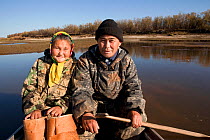 Selkup couple, Andrey Kargochev and his wife, Ludmilla, about to go berry picking by boat in the autumn, Tolka, Krasnoselkup, Yamal, Western Siberia, Russia