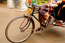 Close-up of the front wheel of a bicycle taxi, Dhaka, Bangladesh, June 2012.