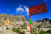 Sign to mountain hut refuge  in the valley of Gerber. Aiguestortes i Estany de Sant Maurici National Park, Pyrenees, Catalonia, Spain