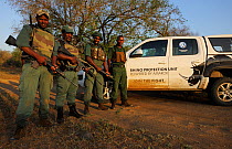 The anti poaching patrol, guards posing by vehicle. iMfolozi National Park, South Africa October 2011